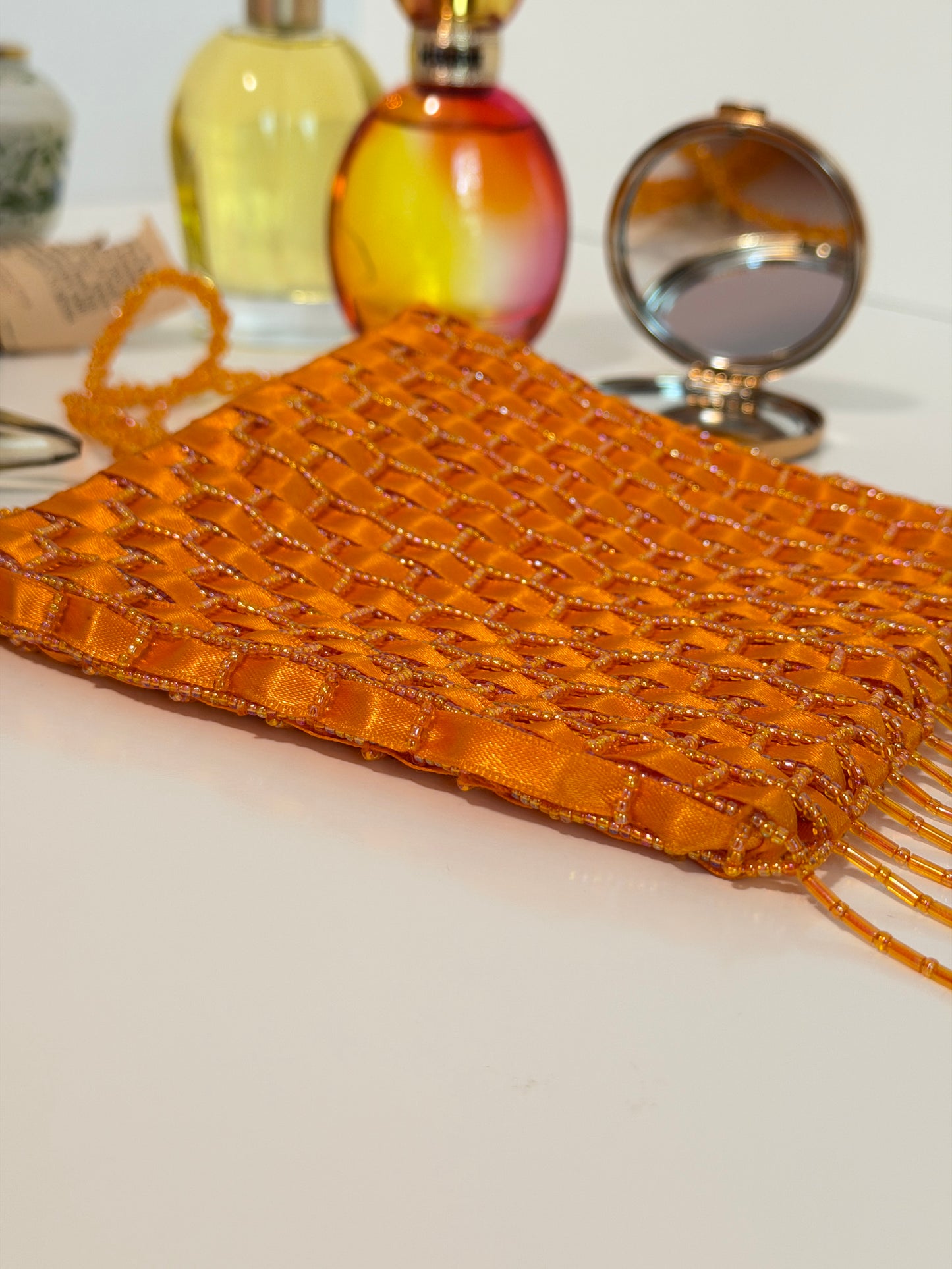 The Dyani - orange geometric beaded purse