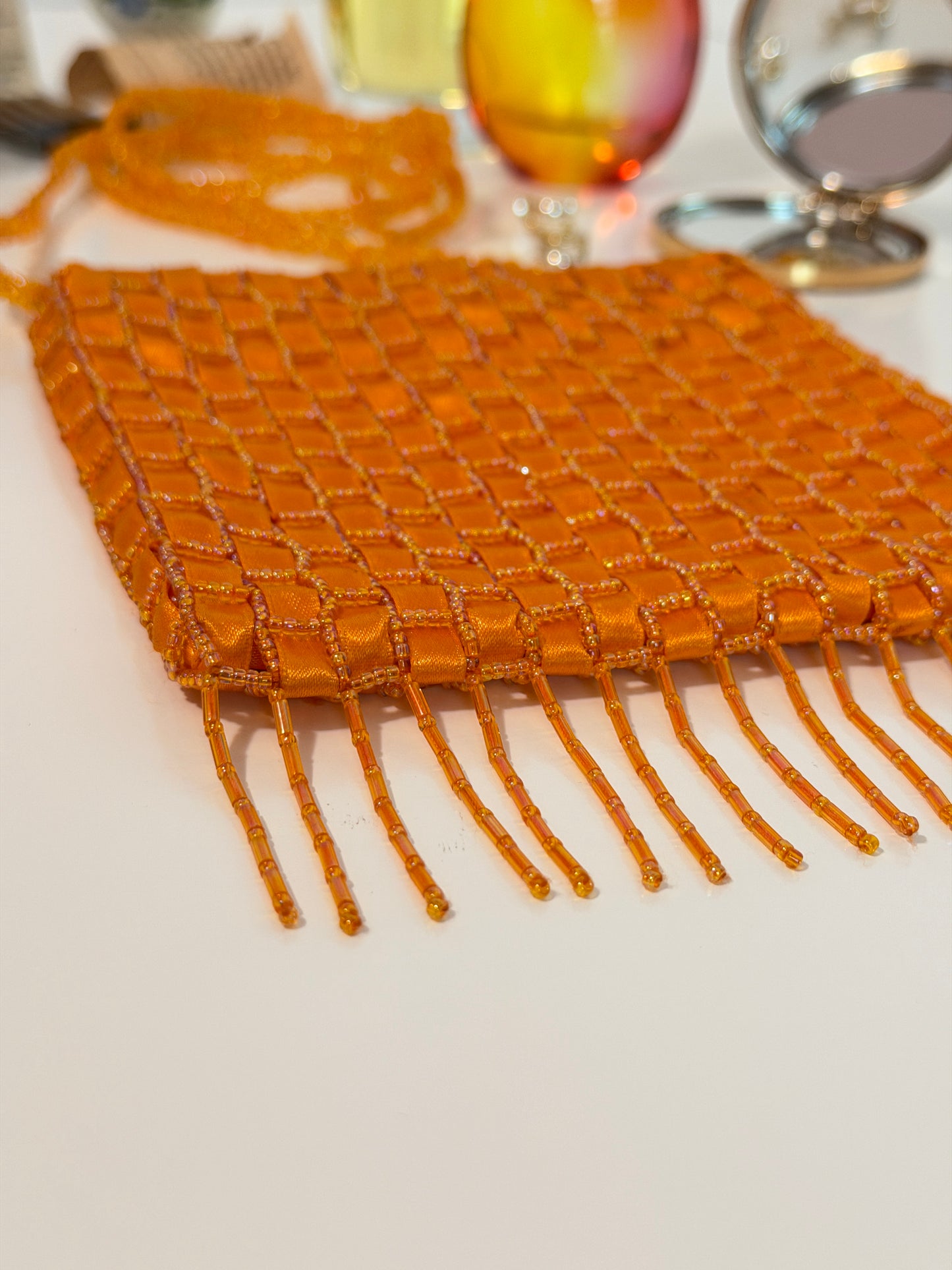 The Dyani - orange geometric beaded purse