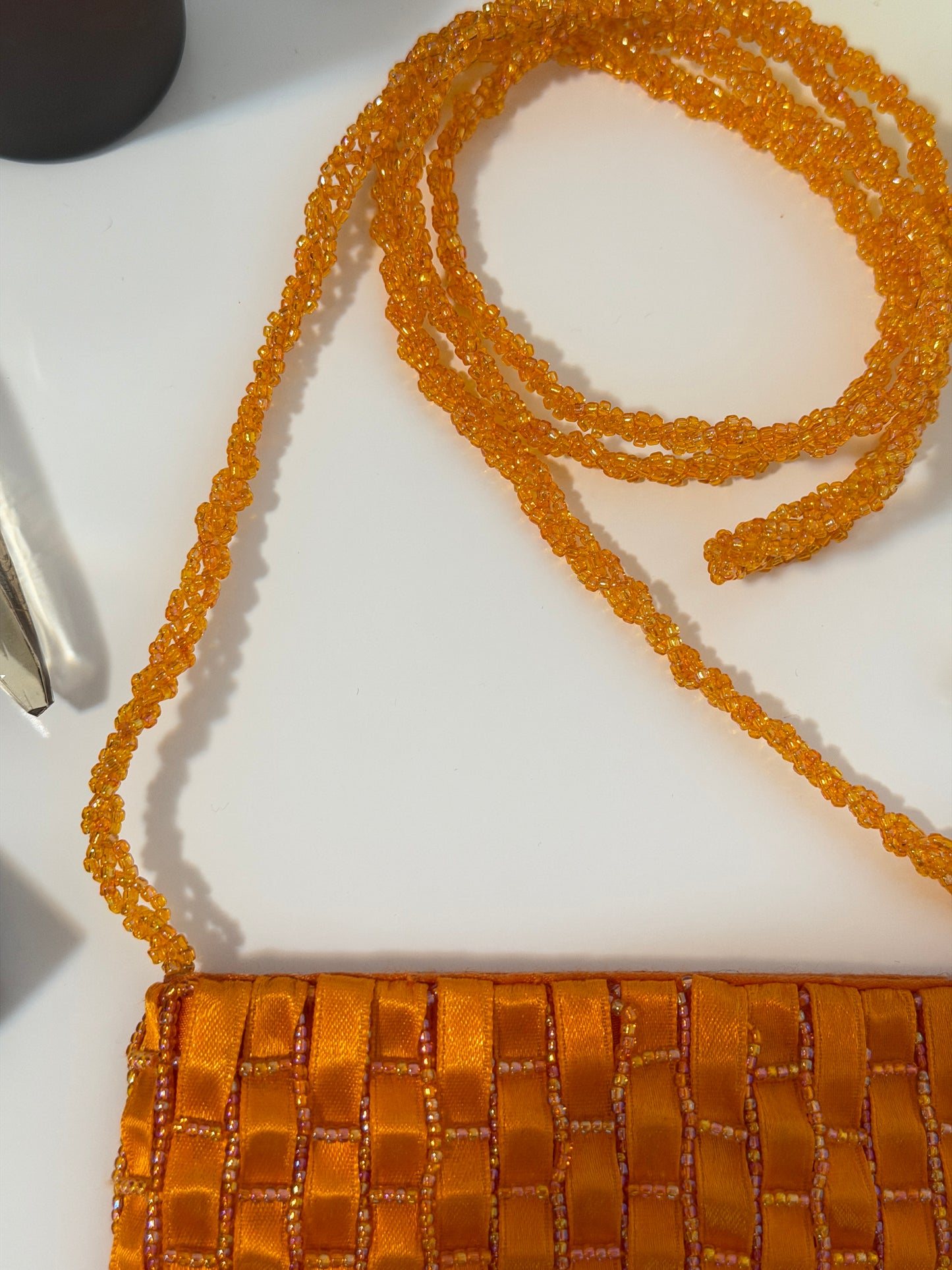 The Dyani - orange geometric beaded purse
